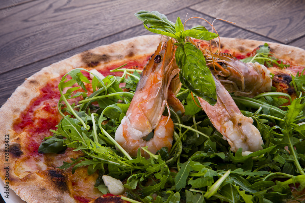 Seafood Italian Pizza slice on wood dish
