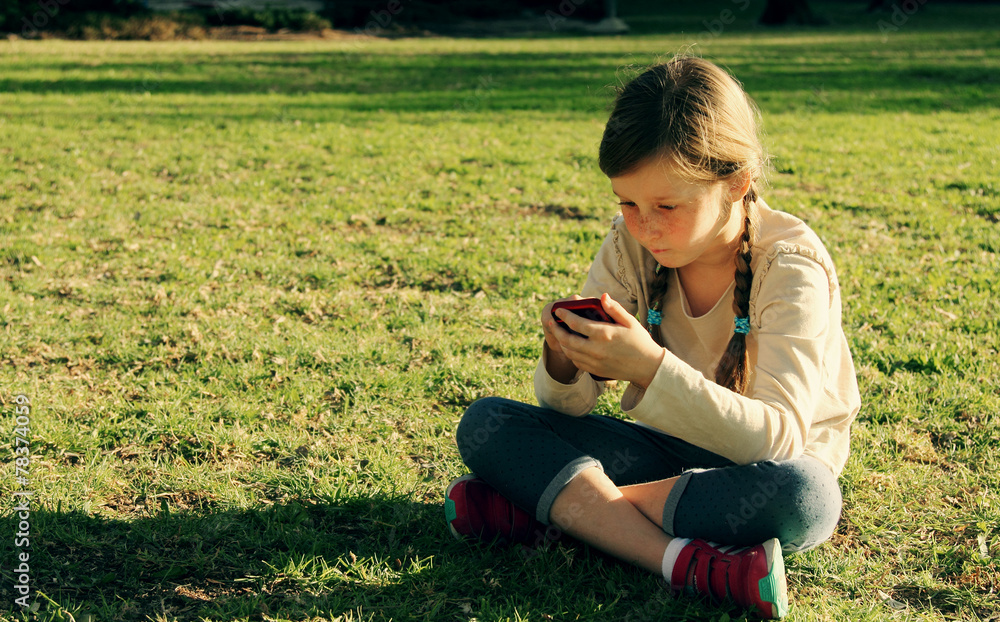 Cute girl with mobile phone