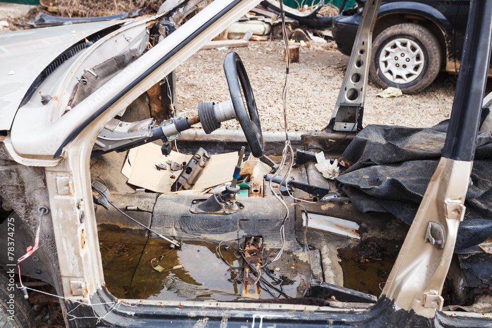 disassembled car at an automobile dump disassembled car at an automobile dump