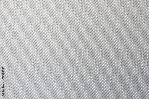 Macro of a silver cardboard texture with a squared pattern