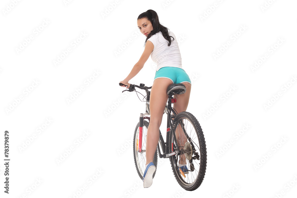 Fototapeta premium sexy girl with a bike on a white background