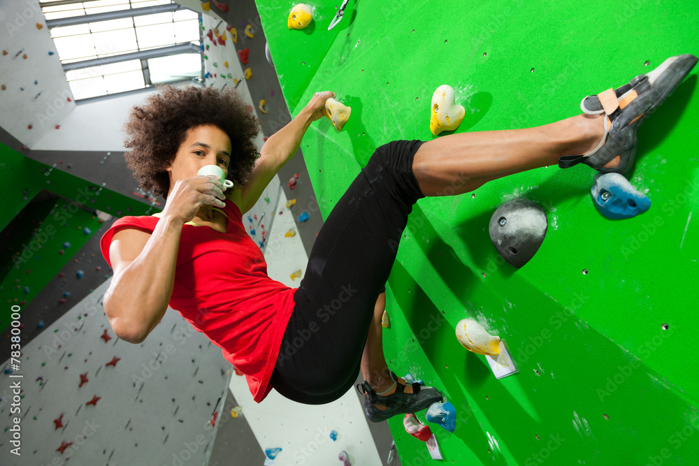 Fototapeta premium woman on artificial climbing wall