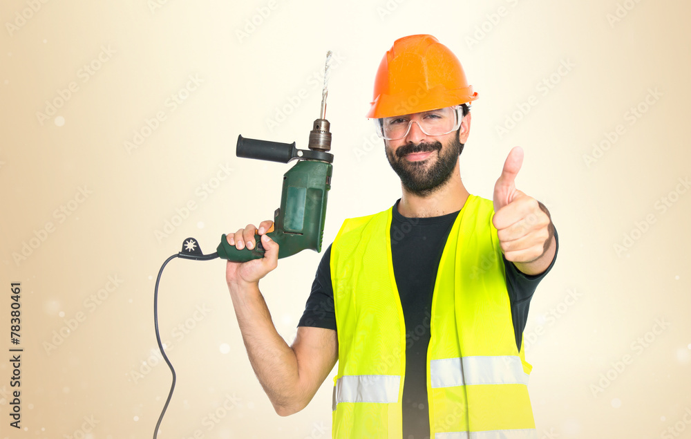 workman with drill over white background workman with drill over white background