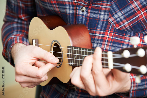 фотографія Close Up Of Man Playing Ukulele