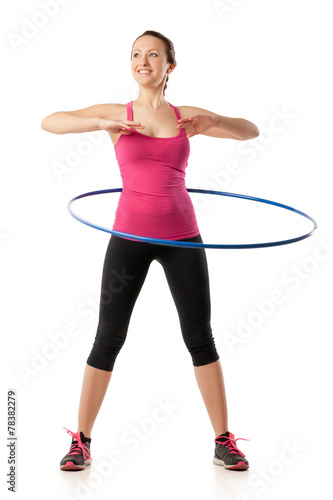 fitness woman working with hula hoop smiling isolated over white