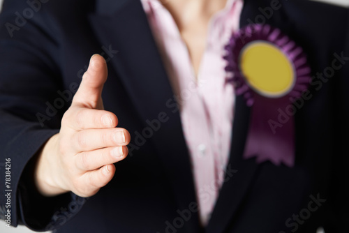 Close Up Of Female Politician Reaching Out To Shake Hands photo