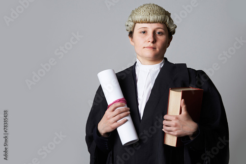 Foto Studio Portrait Of Female Lawyer Holding Brief And Book