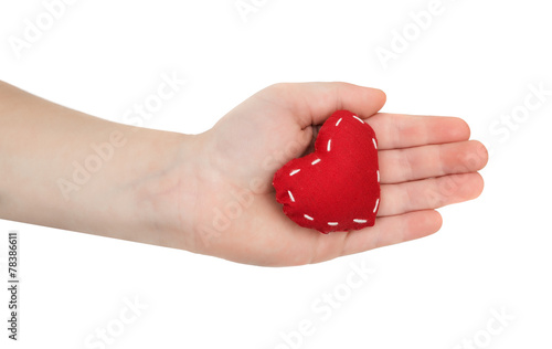 The children's hand holds red heart. isolated on the white