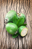 Feijoa fruits on old wooden table.