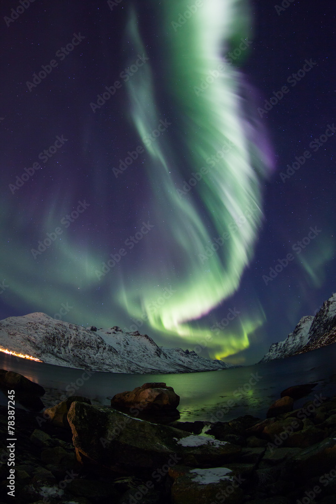 Aurora Borealis reflected between fjords in Tromso
