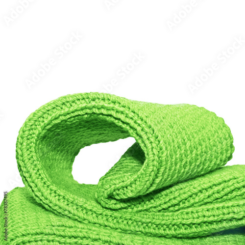 Knitted green cloth close up, on white
