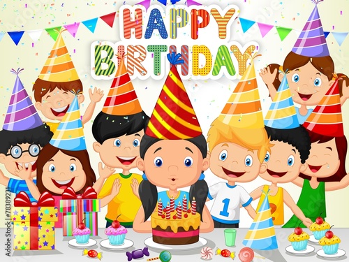 Happy girl blowing birthday candles with his friends