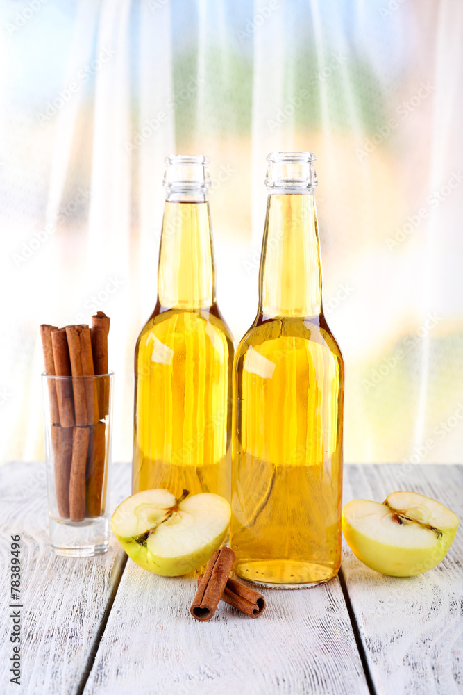 still life with apple cider and fresh apples on wooden table still life with apple cider and fresh apples on wooden table