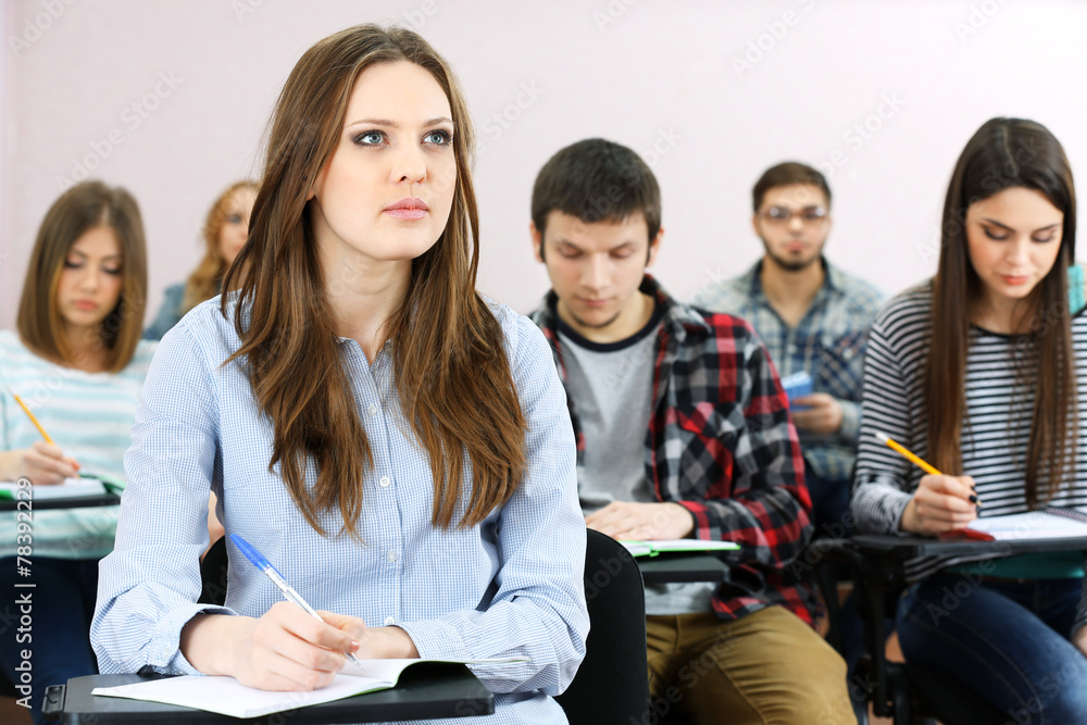 Group of students sitting in classroom Group of students sitting in classroom