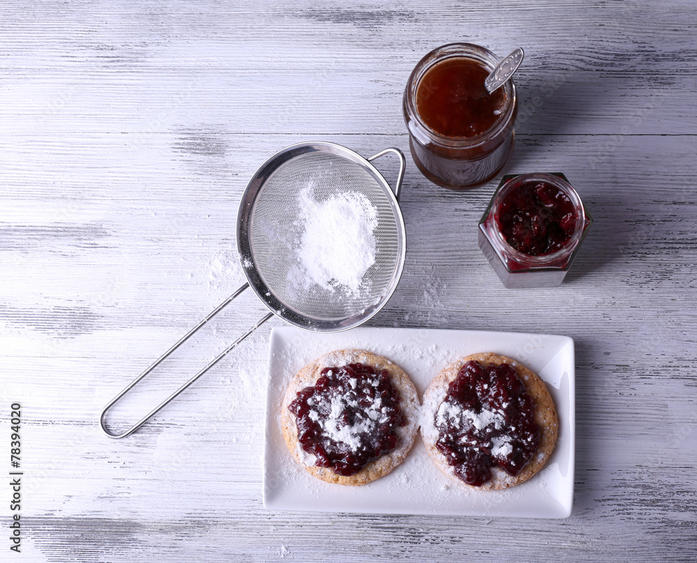 Delicious cookies with jam and powdered sugar