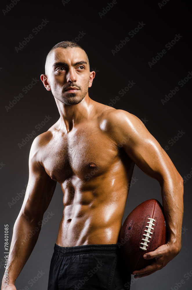 Muscular football player with ball Muscular football player with ball