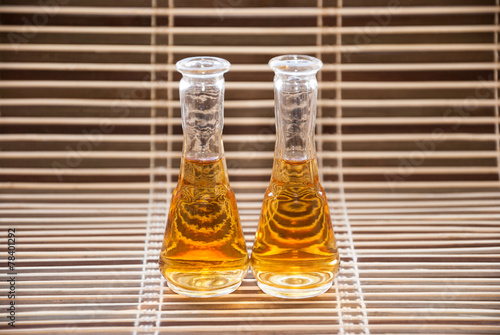 Glasses with rakija on a bamboo background