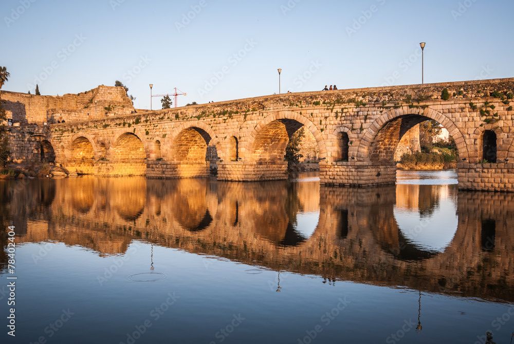 sunset over the monument, Roman bridge over the Guadiana River