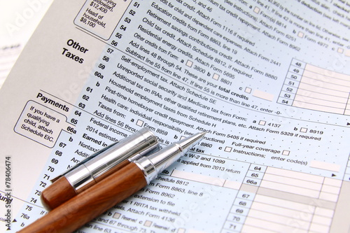 Income tax form and pen. Finance concept