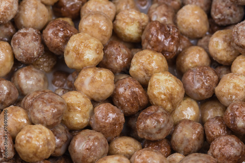 Chocolate and peanut butter puff ball cereal background