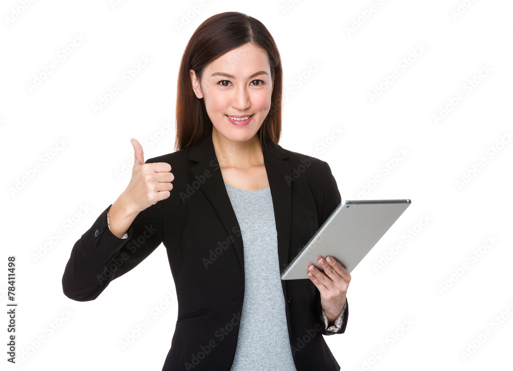 Businesswoman use of tablet and thumb up Businesswoman use of tablet and thumb up