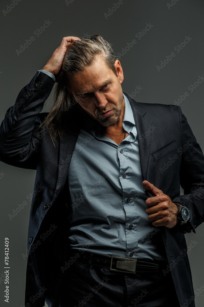 Portrait of stylish long-haired man.