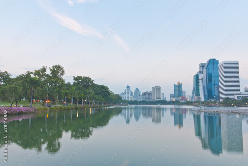 Scenery of a park and Bangkok cityscape view in the evening