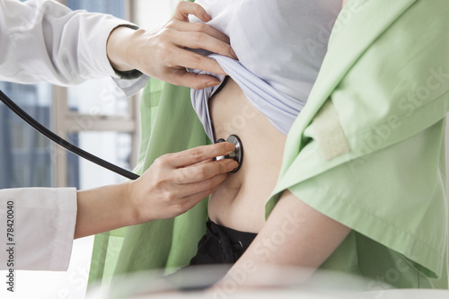 Tableau sur toile Doctor for examination with a stethoscope