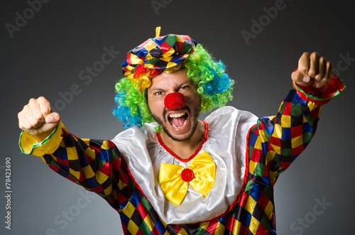 Funny clown in colourful costume