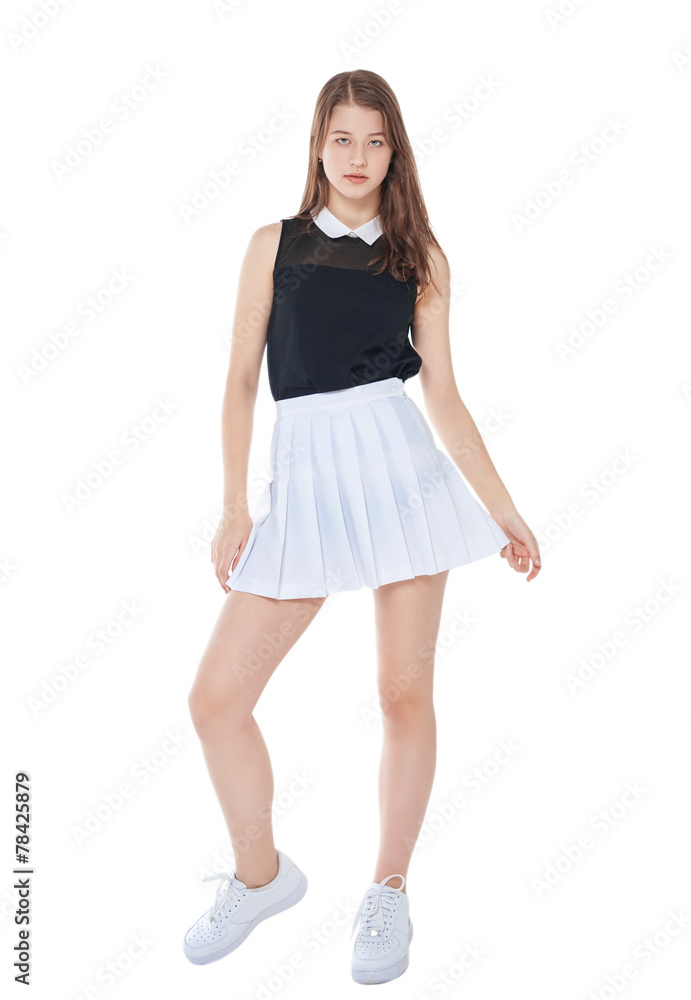 Young fashion girl in white skirt posing isolated Young fashion girl in white skirt posing isolated