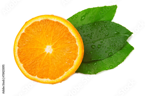 Fototapeta Naklejka Na Ścianę i Meble -  Half of orange and three leaf