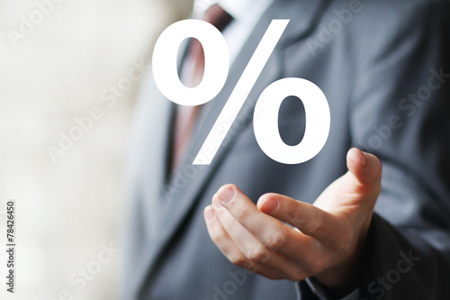Obraz na płótnie Businessman pushing virtual web button percent icon