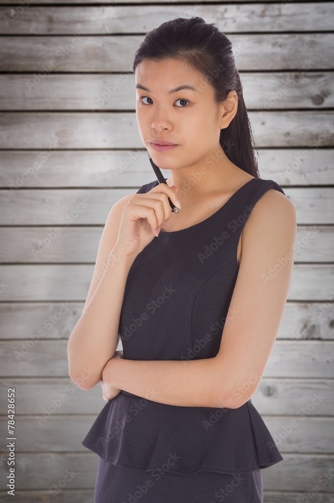 Composite image of thinking businesswoman