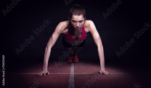 Young woman doing push ups
