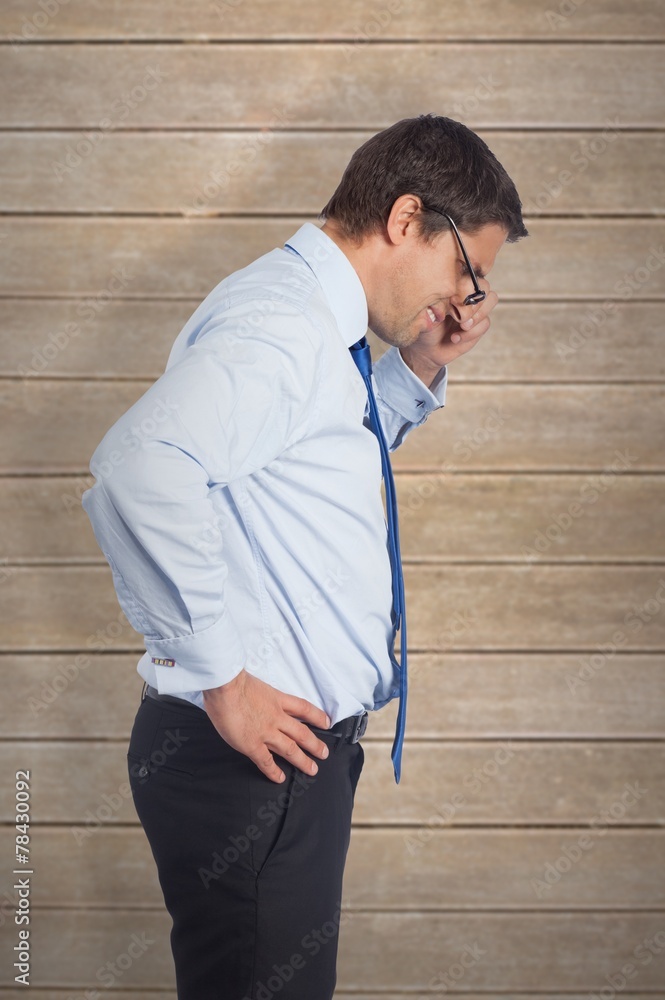 Composite image of thinking businessman tilting glasses Composite image of thinking businessman tilting glasses
