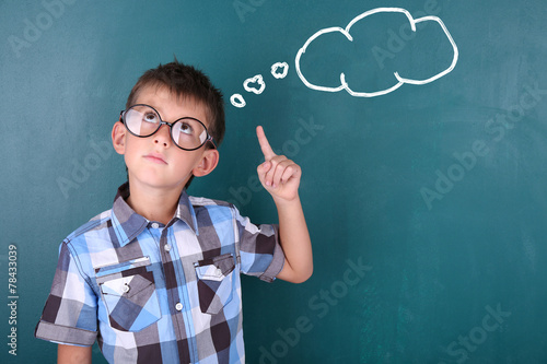 Schoolboy at blackboard in ...