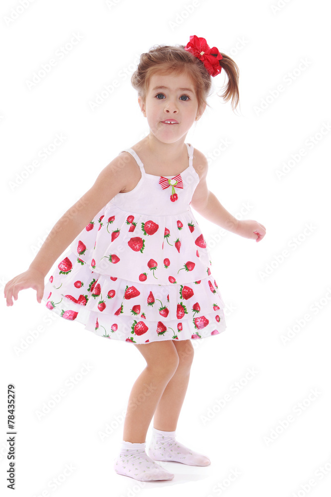 cheerful caucasian girl in a light summer dress. cheerful caucasian girl in a light summer dress.