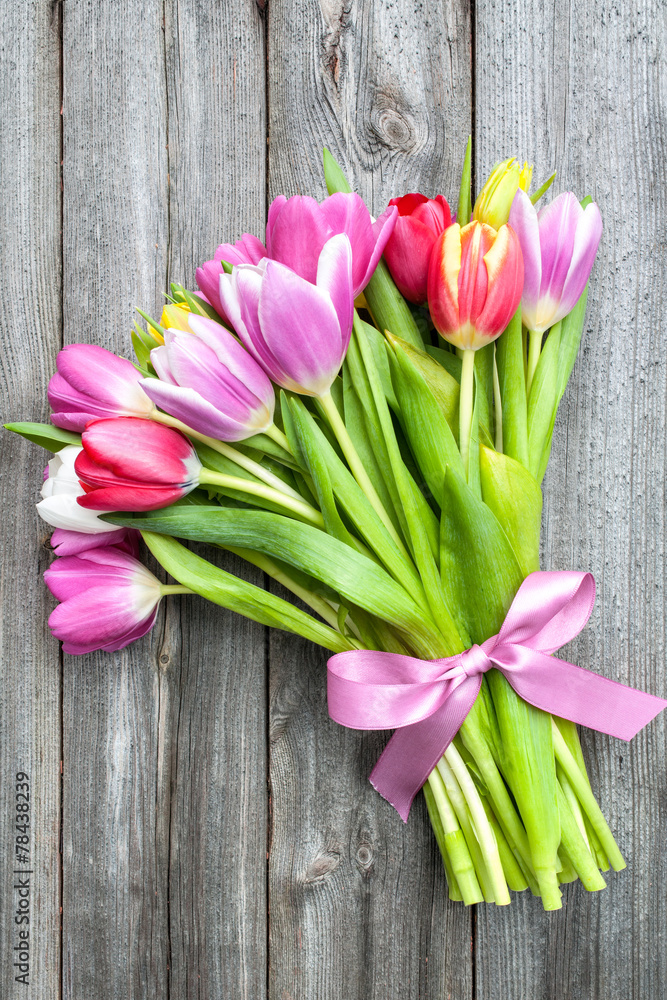 bouquet of spring tulips on old wooden background bouquet of spring tulips on old wooden background