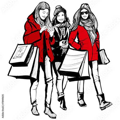 Three young fashionable women shopping