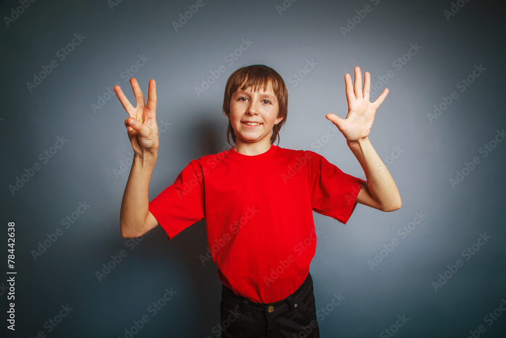 European-looking boy of ten years shows a figure eight finger on European-looking boy of ten years shows a figure eight finger on