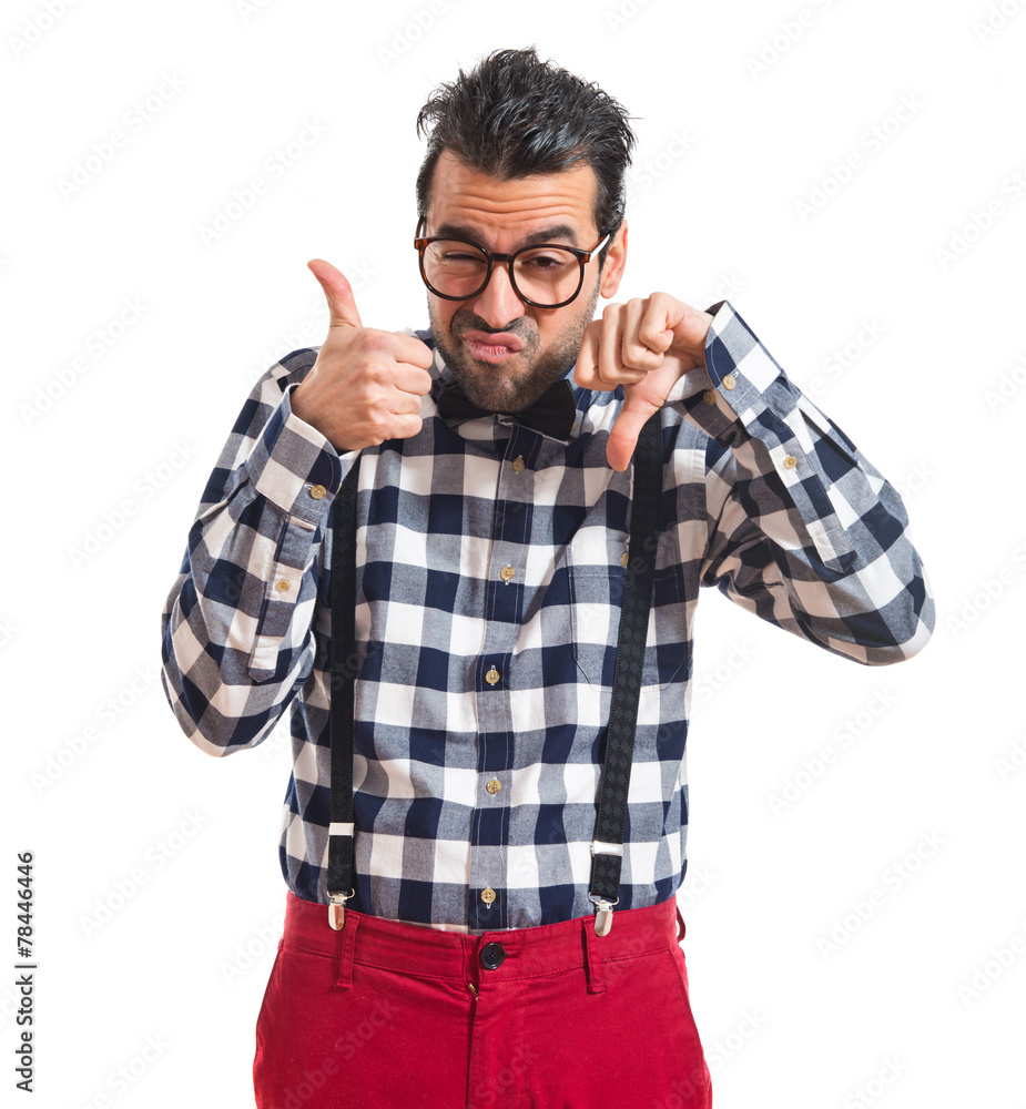 Posh boy making good-bad sign Posh boy making good-bad sign