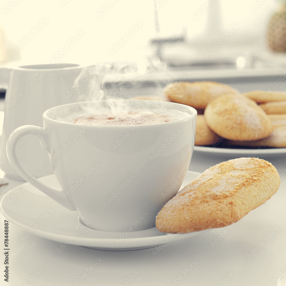 cappuccino and biscuits on the kitchen table cappuccino and biscuits on the kitchen table