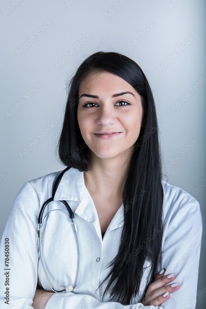Beautiful brunette smiling woman doctor with stethoscope Beautiful brunette smiling woman doctor with stethoscope