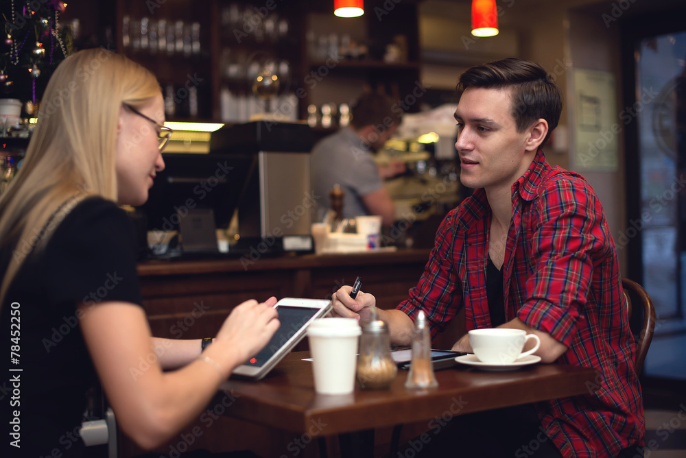 friend couple in the cafe chatting and drinking coffee friend couple in the cafe chatting and drinking coffee