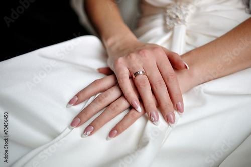 hands of a bride with a wedding ring