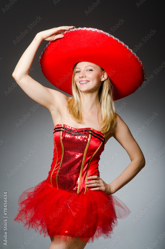 Woman wearing sombrero hat in funny concept Woman wearing sombrero hat in funny concept