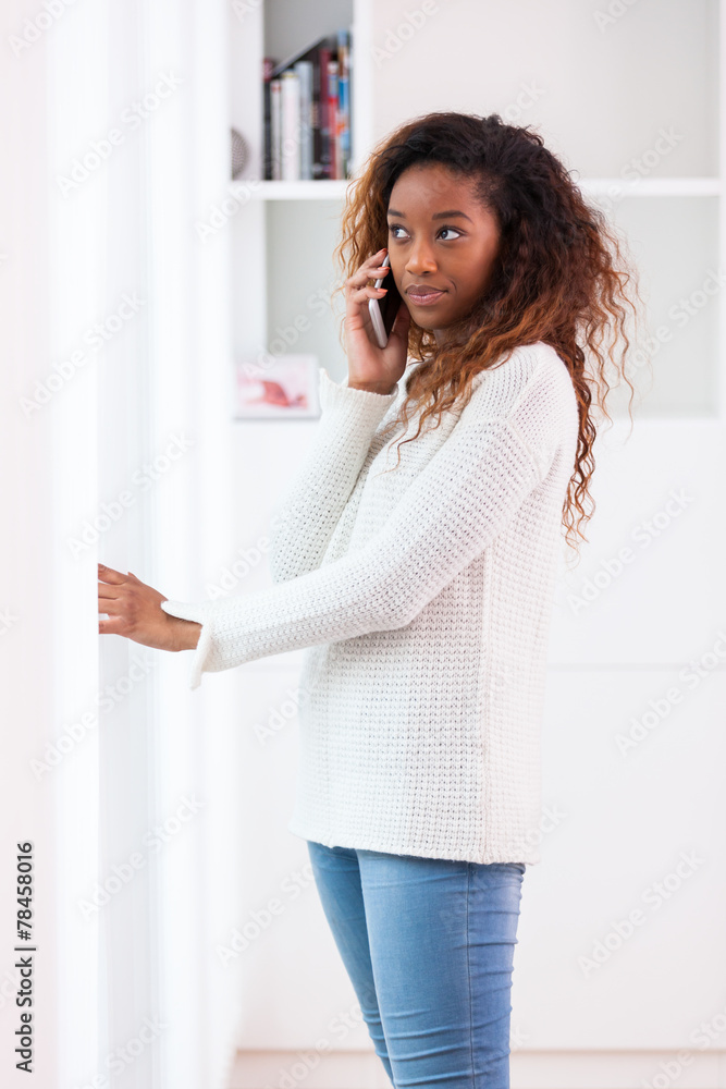 African American woman talking on a mobile phone - Black people African American woman talking on a mobile phone - Black people