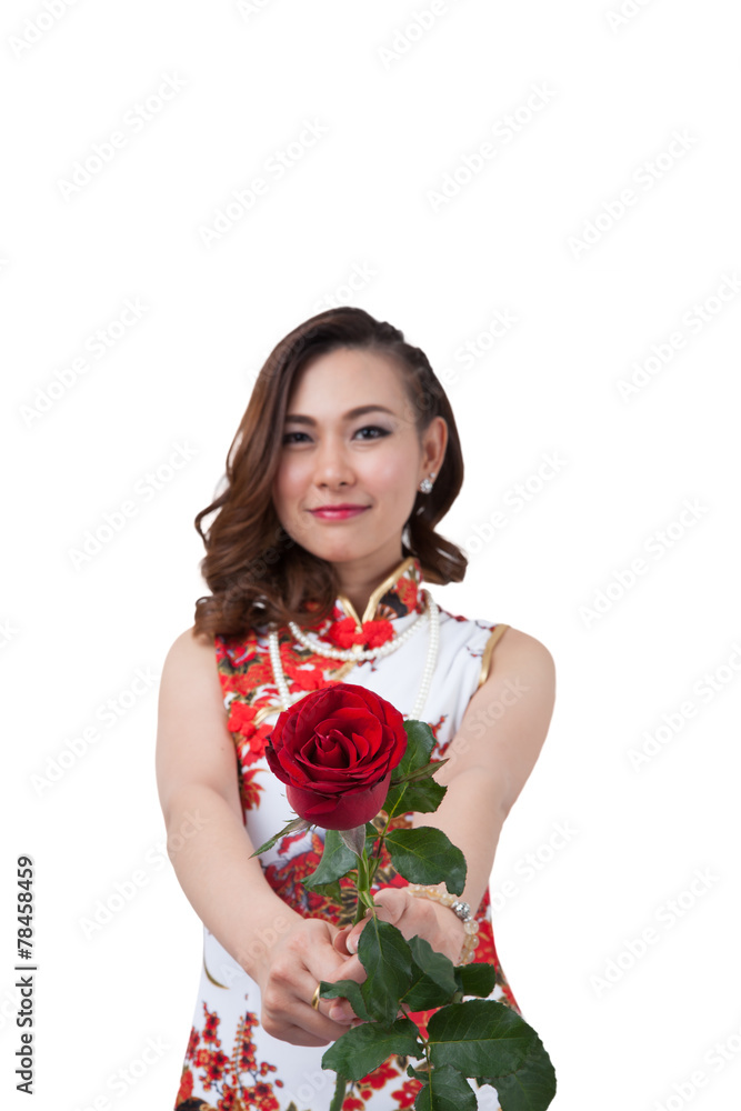 Chinese woman in cheongsam with rose. Chinese woman in cheongsam with rose.