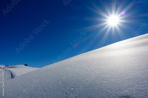 Bergsonne über dem Schneefeld © by paul