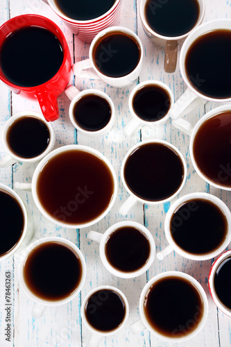 Many cups of tea on table close-up